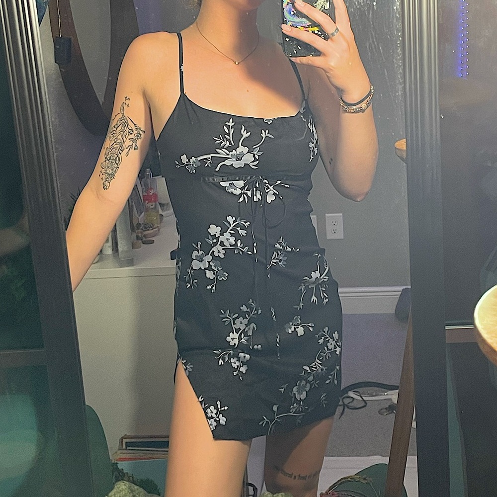 black mini dress with grey florals and small slit